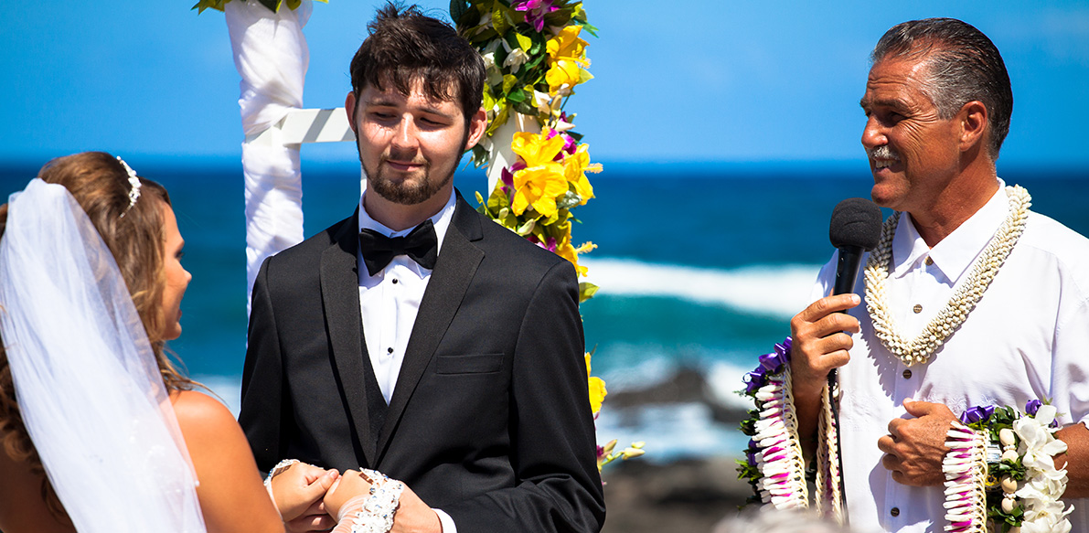 Rev Mike nelson at a Beach wedding with stephanie and Ryan